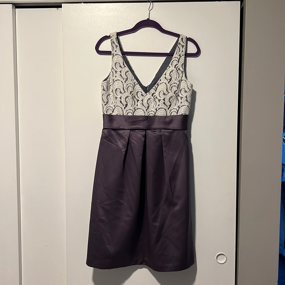 Purple and lace formal dress with a low v
